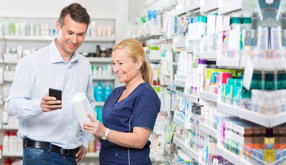 pharmacist assisting man about the medicine