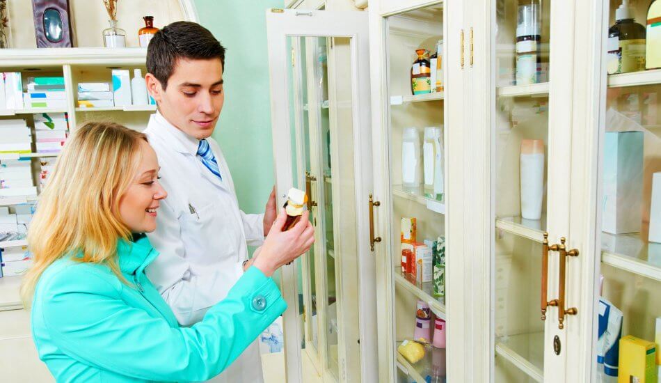 pharmacist assisting customer